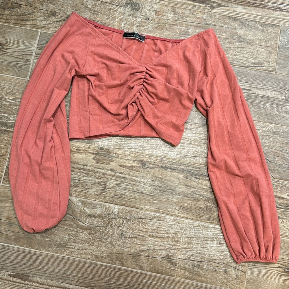 Long sleeve crop top. V-neckline. Coral color. Size small.